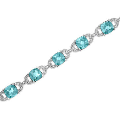 Pulsera de tenis de moda en plata de ley 925 con topacio azul de talla cojín de 7 x 7 mm y diamantes de talla redonda de 1/20 ct (color IJ, claridad I1-I2) - 18 cm