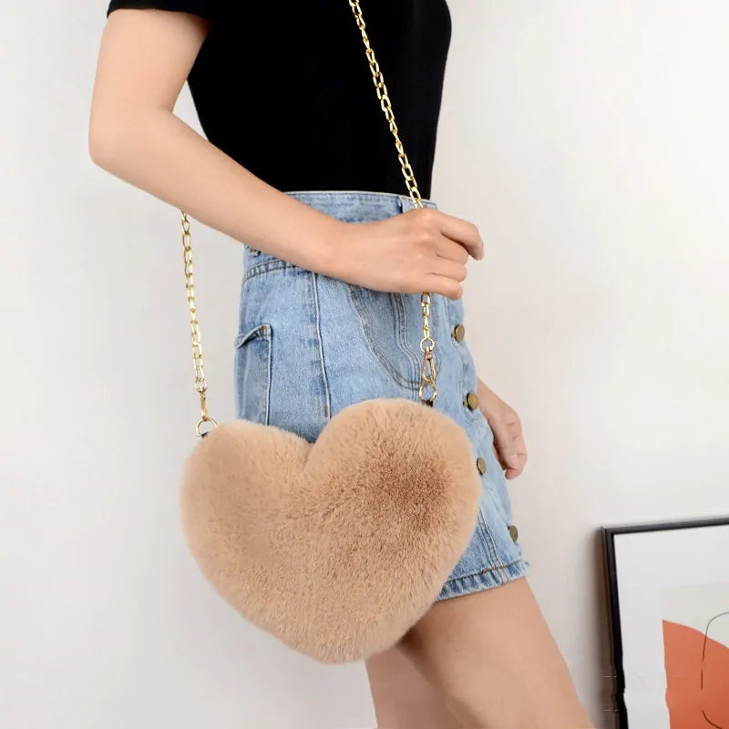 Heart Shaped Faux Fur Crossbody Wallet Crafted from high-quality faux fur, this wallet is soft to the touch and luxurious to look at.