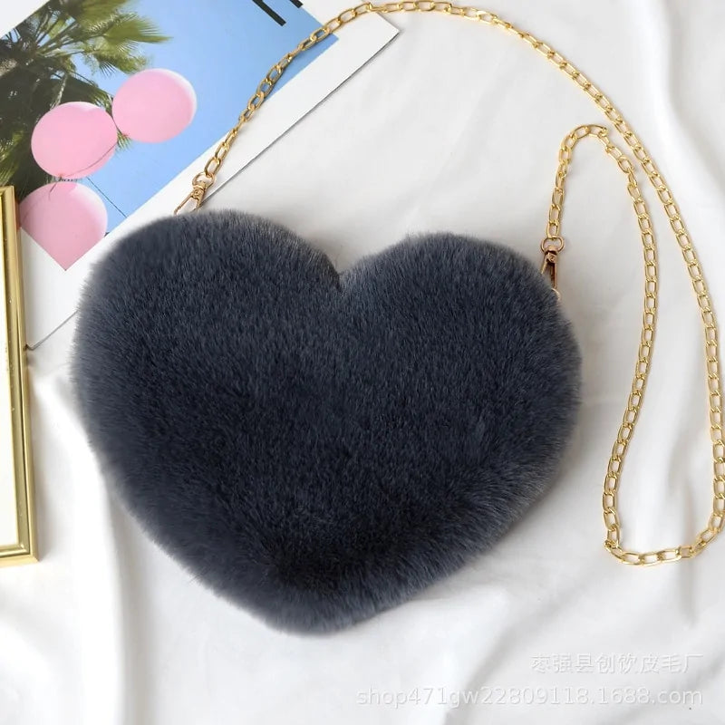 Heart Shaped Faux Fur Crossbody Wallet Crafted from high-quality faux fur, this wallet is soft to the touch and luxurious to look at.