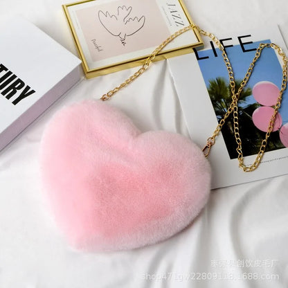 Heart Shaped Faux Fur Crossbody Wallet Crafted from high-quality faux fur, this wallet is soft to the touch and luxurious to look at.