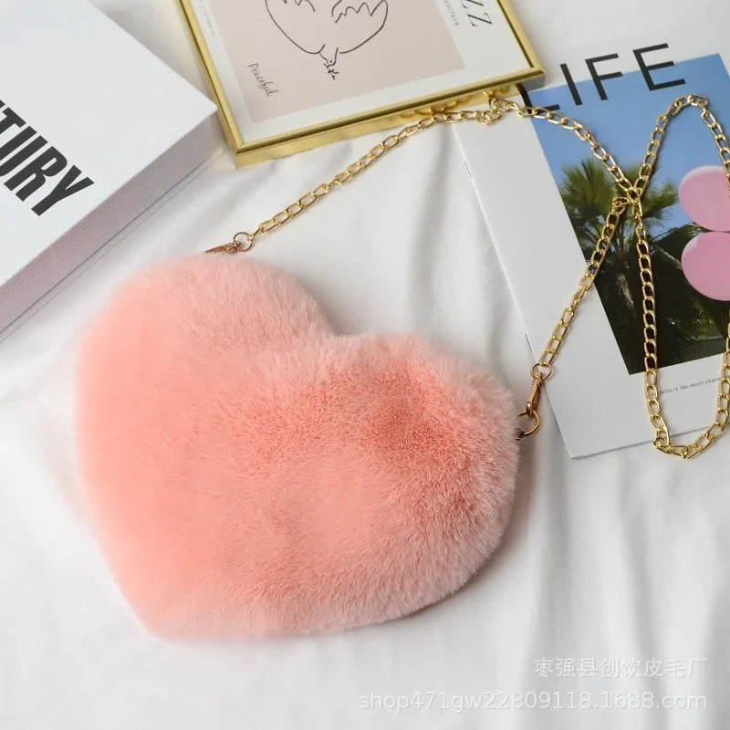 Heart Shaped Faux Fur Crossbody Wallet Crafted from high-quality faux fur, this wallet is soft to the touch and luxurious to look at.