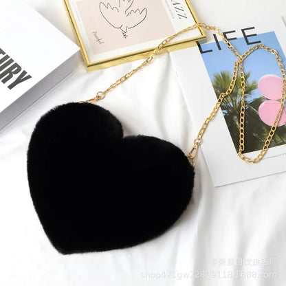 Heart Shaped Faux Fur Crossbody Wallet Crafted from high-quality faux fur, this wallet is soft to the touch and luxurious to look at.