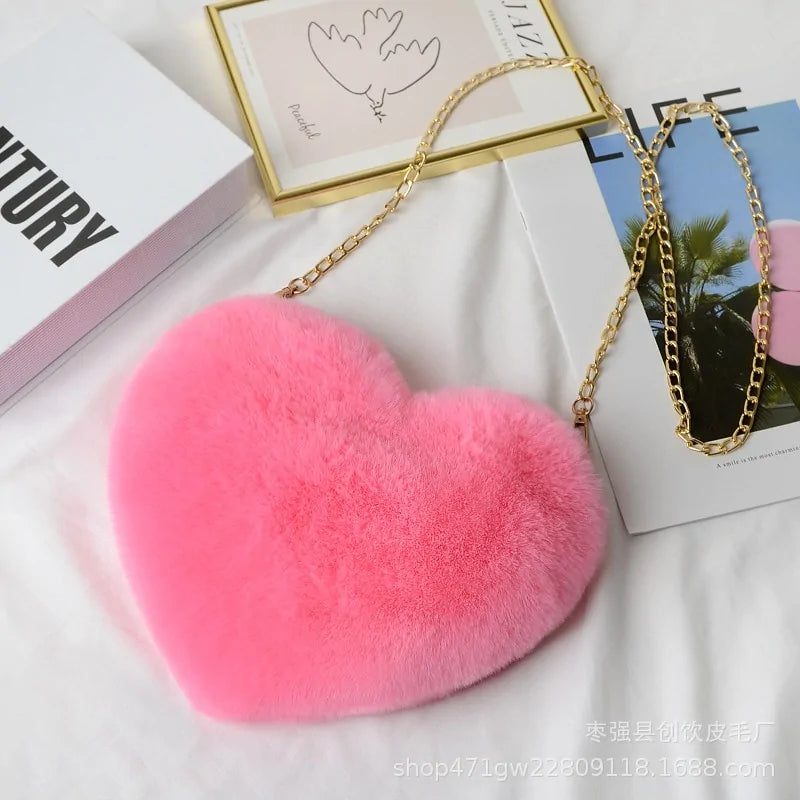 Heart Shaped Faux Fur Crossbody Wallet Crafted from high-quality faux fur, this wallet is soft to the touch and luxurious to look at.