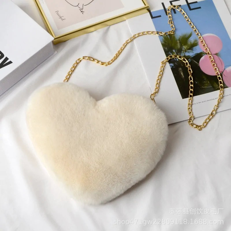 Heart Shaped Faux Fur Crossbody Wallet Crafted from high-quality faux fur, this wallet is soft to the touch and luxurious to look at.