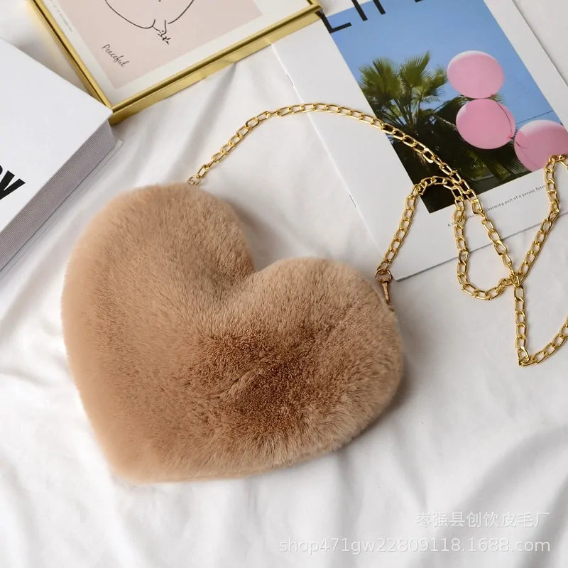 Heart Shaped Faux Fur Crossbody Wallet Crafted from high-quality faux fur, this wallet is soft to the touch and luxurious to look at.