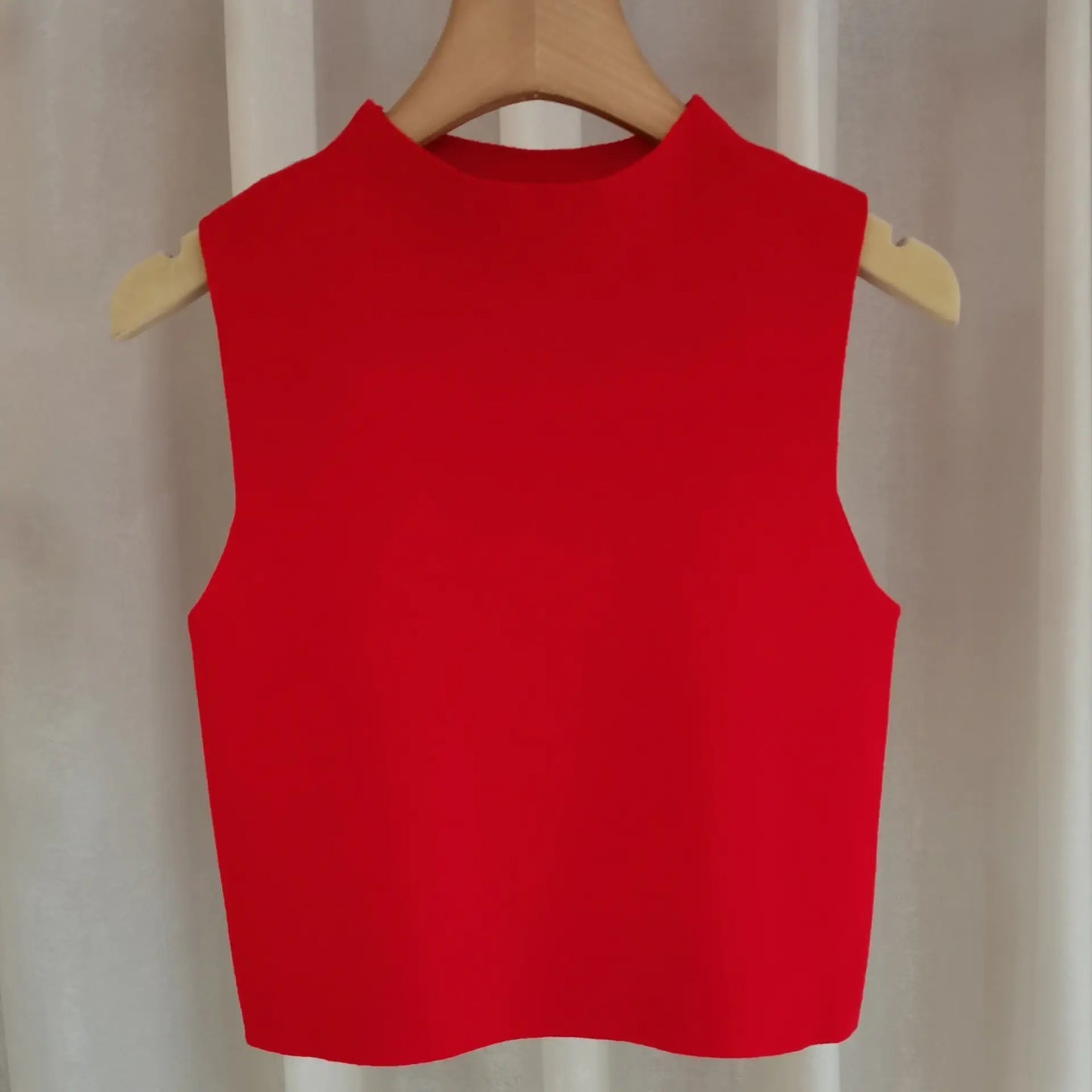 Women's small camisole vest with sweater underneath