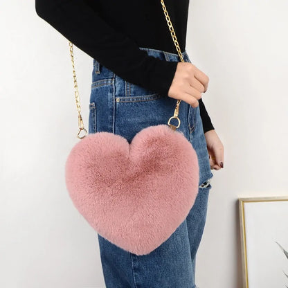 Heart Shaped Faux Fur Crossbody Wallet Crafted from high-quality faux fur, this wallet is soft to the touch and luxurious to look at.